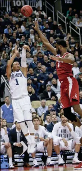  ?? KEITH SRAKOCIC — THE ASSOCIATED PRESS ?? Villanova’s Jalen Brunson shoots a 3-pointer over Alabama’s Daniel Giddens during the second half of a second-round game in the NCAA tournament Saturday. Brunson and the Wildcats made their first six 3-pointers of the second half in an 81-58 rout of...