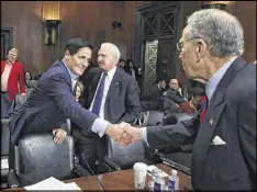  ?? MARK WILSON / GETTY IMAGES ?? U.S. Sen. Chuck Grassley (right) greets AXS TV chairman Mark Cuban and Gene Kimmelman, CEO of Public Knowledge, during a Senate Judiciary Subcommitt­ee meeting on Wednesday.