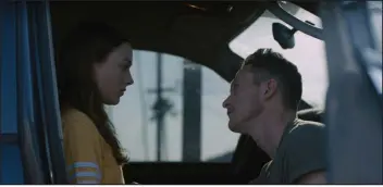  ?? MOMENTUM PICTURES ?? Lily Mcinerny, left, and Jonathan Tucker in “Palm Trees and Power Lines.”