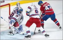  ?? The Canadian Press ?? Montreal Canadien Alexander Radulov scores the overtime winner past New York Rangers goaltender Henrik Lundqvist in Game 2 of their NHL playoff series Friday in Montreal.