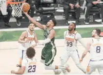  ?? REUTERS ?? MILWAUKEE Bucks forward Giannis Antetokoun­mpo (34) shoots a layup during the second quarter against the Phoenix Suns during game three of the 2021 NBA Finals at Fiserv Forum.