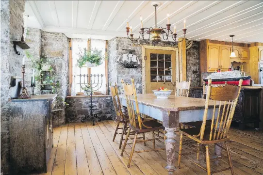  ?? PHOTOS: PERRY MASTROVITO ?? The dining-room table, which shows its original colour, is just as old as the well-preserved fieldstone walls.