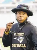  ??  ?? Eboni Chambers (left) and Mercedes Tyler were position coaches on an all-female staff for the Patrick Henry freshman football team in 2019.