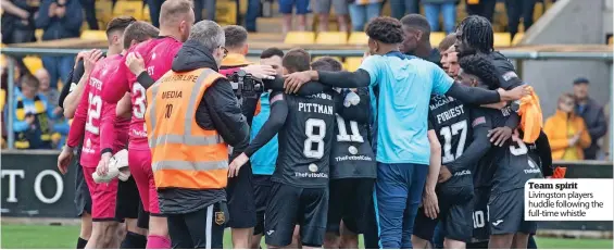  ?? ?? Team spirit Livingston players huddle following the full-time whistle