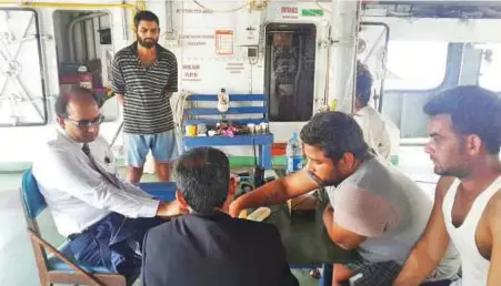  ??  ?? Indian Consul General in Dubai Vipul meets the sailors stranded on the MV Sharjah Moon at Hamriya port in Sharjah.