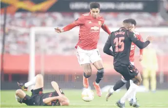  ?? — AFP photo > Turn to Page 18 for story ?? Manchester United’s Marcus Rashford (centre) controls the ball during the UEFA Europa League Round of 32, second leg match against Real Sociedad at Old Trafford in Manchester.