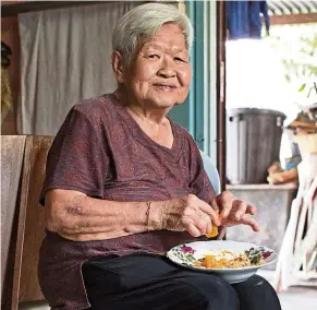 ??  ?? Kamala is of Chinese origin but married a Chetti man and adopted the culture and culinary skills of the community. She has since taught all the community’s recipes to her daughter-in-law Wenila.