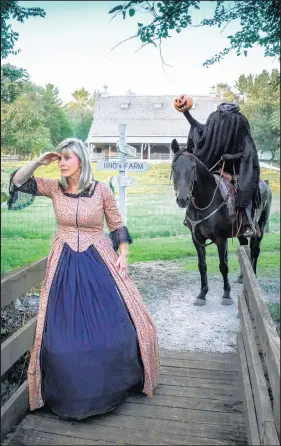  ??  ?? Cindy Horgash prepares for one of the tours that follows the story of “The Legend of Sleep Hollow.” The Lake County Parks Department offers the show during two fall weekends each year at Buckley Homestead.