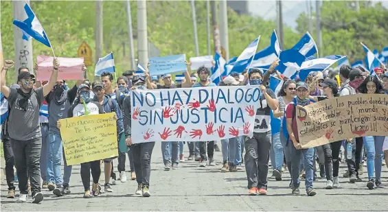  ?? AP ?? Protesta. Una marcha en Managua contra el diálogo que propone el gobierno mientras continúa la represión de los estudiante­s anti Ortega.