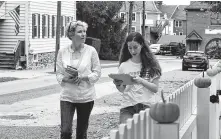  ?? Tom Gralish / Tribune News Service ?? Chrissy Houlahan, left, Democratic House candidate in Pennsylvan­ia, canvasses with a campaign volunteer. Houlahan said there’s now “permission to talk” about gun issues in her district.