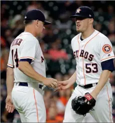  ??  ?? Houston Astros manager AJ Hinch (14) pulls relief pitcher Ken Giles (53) from the baseball game during the ninth inning against the Oakland Athletics on Tuesday, in Houston.
AP PhoTo/dAVId J. PhIllIP