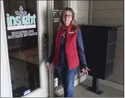  ?? JOHN HANNA — THE ASSOCIATED PRESS ?? Bridgit Smith, executive director of the Insight Women's Center, stands outside the door to its education office and boutique with clothes and other supplies for new parents on Jan. 31 in Lawrence, Kansas.