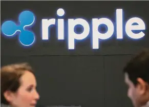  ?? — Reuters ?? Making ripples: The logo of blockchain company Ripple is seen at a banking and financial conference in Toronto, Canada. Ripple is already working with banks in other countries to overhaul how they handle payments.