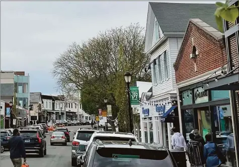  ?? Hearst Connecticu­t Media ?? People shop on Main Street in Westport last week. Several of Connecticu­t’s largest companies have seen rising demand for goods and services this year.