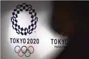  ?? EUGENE HOSHIKO / AP 2021 ?? The cost for last year’s COVID-delayed Tokyo Olympics was twice what was forecast in 2013 when the city was awarded the Games.