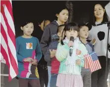  ??  ?? POSSIBLE FUTURE STUDENTS: Serena Jin, 8, of Boston sings ‘Edelweiss,’ as Asian-American children tell the crowd their career ambitions yesterday at Copley Square.