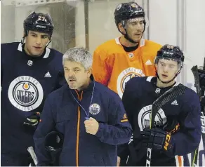  ?? LARRY WONG ?? Edmonton Oilers rookie Kailer Yamamoto, front right, and Milan Lucic, left, are two of the many new players brought in since general manager Peter Chiarelli took over the club two years ago.