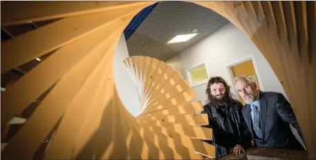  ??  ?? Paraic McLoughlin and his sculpture ‘Transit’ which has been installed in the main atrium of Sligo University Hospital.