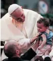  ?? Buda Mendes/afp/getty Images ?? Pope Francis blesses a child after arriving in Rio de Janeiro on Monday.