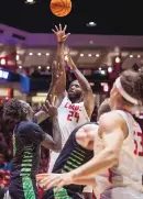  ?? CHANCEY BUSH/JOURNAL ?? UNM’s Morris Udeze (24) puts up a shot during the Lobos’ NIT game against Utah Valley on Wednesday night at the Pit.