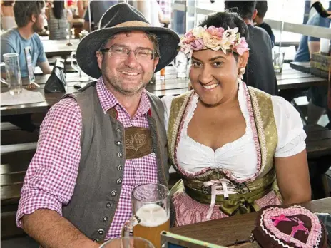  ?? Photos: Nev Madsen ?? PROST!: Dressed in traditiona­l German attire, Jerry and Jules O’Sullivan joined the happy crowd for some ale and snacks at Oktoberfes­t celebratio­ns at The Bavarian in Grand Central.