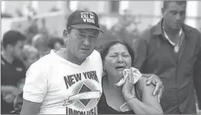  ??  ?? Relatives of victims from the plane crash. (Photo: Reuters)