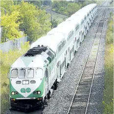  ?? BOB TYMCZYSZYN/STANDARD FILE PHOTO ?? A GO train passes under the bridge in Merritton as it makes way out of Niagara in September 2014.
