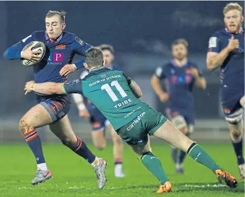  ??  ?? YOU CAN’T CATCH ME: Edinburgh fly-half Nathan Chamberlai­n bursts free from Connacht’s Matt Healy.