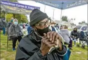  ?? Irfan Khan Los Angeles Times ?? ANTHONY ANGULO, 71, awaits his COVID-19 vaccinatio­n at South Park Recreation Center in L.A.