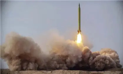  ??  ?? A missile is launched in a drill in Iran. Photograph: AP