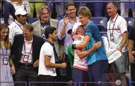  ?? ABBIE PARR / GETTY IMAGES ?? Kevin Anderson used a chair and flower box to climb into his guest box after his victory made him the lowest-ranked man to make a U.S. Open final.
