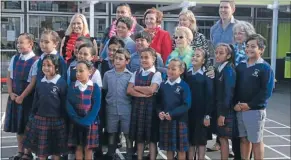  ?? Photos: RHIANNON MCCONNELL ?? Say cheese: Anne Tolley and children from Holy Family School in Cannons Creek.