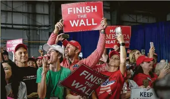  ?? Gabriella Demczuk / New York Times ?? Supporters of President Donald Trump rally on Sunday in Macon, Ga. Trump showed the GOP in the midterms’ final days that there may be no way for Republican­s to escape his shadow.