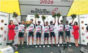  ?? Supplied photo ?? Cyclists from UAE Team Emirates pose on the stage after winning thet Team Classifica­tion during the the Tour de Romandie which came to a close with a thrilling group sprint in Geneva. —