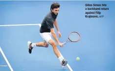  ?? AFP ?? Gilles Simon hits a backhand return against Filip Krajinovic.