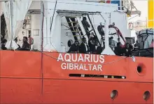  ?? OLMO CALVO THE ASSOCIATED PRESS ?? Migrants arrive on the “SOS Mediterran­ee” Aquarius at Valencia, Spain, on Sunday. Ships in the Aquarius aid convoy docked Sunday at the Spanish port, ending a weeklong ordeal for hundreds of people.