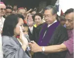  ??  ?? ARROYO taking her oath as president.