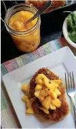  ?? Tribune News Service ?? ■ Pickled peaches add a bright, summery note to fried pork chops.