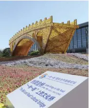  ?? XINHUA/HOU JUN ?? The Golden Bridge on Silk Road structure outside the National Convention Center in Beijing. The Belt and Road Forum for Internatio­nal Cooperatio­n was held from May 14 to 15, 2017.