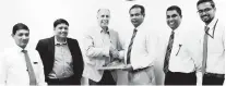  ??  ?? Steven Deskovic, Director IBM Asia Pacific - Communicat­ions Sector Industry Sales (centre left) exchanging the partnershi­p agreement with Dr. Prasad Samarasing­he, Managing Director - Lanka Bell Limited (center right). Also in the picture (From left):...