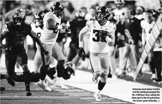  ?? AP ?? Defensive back Quinn Schulte and the Hawkeyes jumped the No. 4 Nittany Lions, taking the third spot in the AP poll before the teams’ game Saturday.