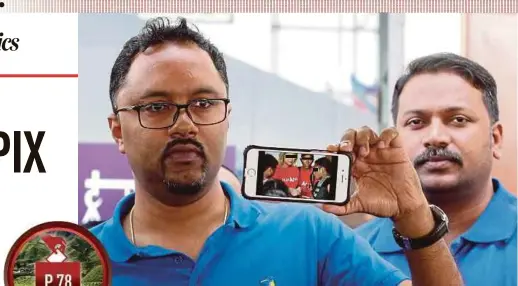  ?? PIC BY ABDULLAH YUSOF ?? MIC Youth chief R. Thinalan (left) showing a picture of the alleged offence in Tanah Rata, Cameron Highlands, yesterday.