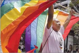  ??  ?? Randy Burns, co-founder of Gay American Indians, walks during the Pride parade in San Francisco on Sunday.