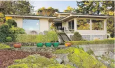  ??  ?? The ocean side of the house — before the massive overhaul — shows the sleek lines of a mid-century home designed by John Di Castri.