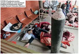  ??  ?? COVID-19 patients receive oxygen outside an overwhelme­d hospital in Kathmandu, Nepal. Credit: Navesh Chitrakar/reuters