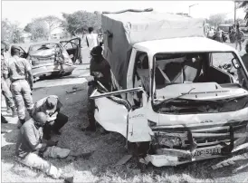  ??  ?? Several passengers travelling to Ntabazindu­na in a Toyota Hiace truck were injured after the truck hit the back of the BMW (left) whose driver lost control as he avoided colliding with a commuter omnibus along the Bulawayo-Harare Road near the HQ1...