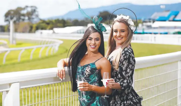  ??  ?? SUCCESS THE TIP: Kimberley Vale and Maddison Simpson model the latest racing fashion ahead of the Cairns Cup racing carnival at Cannon Park. Picture: BRENDAN RADKE