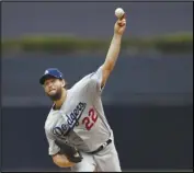  ?? Associated Press ?? DEALING Dodgers starting pitcher Clayton Kershaw works against a San Diego Padres batter during the first inning on Thursday in San Diego. Kershaw won for the 16th time in the Dodgers’ 1-0 victory.