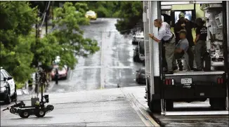  ?? RALPH BARRERA / AMERICAN-STATESMAN 2010 ?? Austin police send a bomb squad robot into the Blackwell-Thurman Criminal Justice Center in May 2010 to inspect a suspicious package. The department has four robots that are more than 8 years old and wants to modernize that equipment with a...