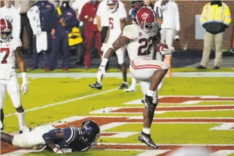  ?? Rogelio V. Solis / Associated Press ?? Alabama running back Najee Harris ( 22) dances after scoring one of his five touchdowns in the Crimson Tide’s 6348 win. Harris, an Antioch High alum, rushed for 206 yards on 23 carries.